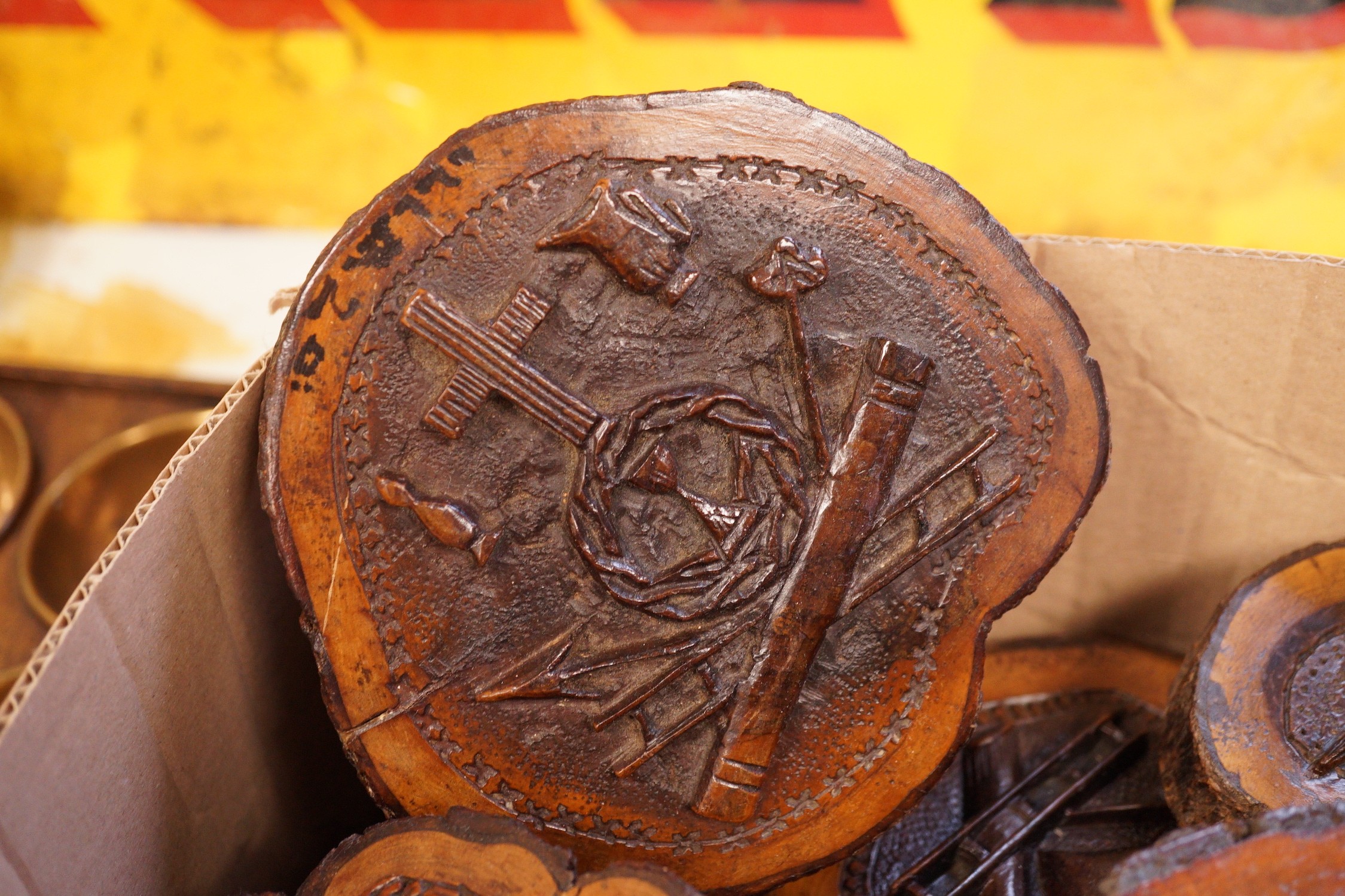 A collection of Jerusalem carved oyster olive wood roundels, religious and other symbolism